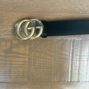 Gucci Gold and Black Belt with Iconic GG Emblem